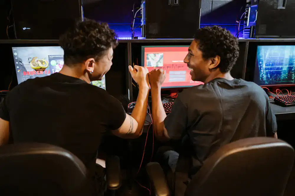Esports team discussing strategy and giving a fist bump