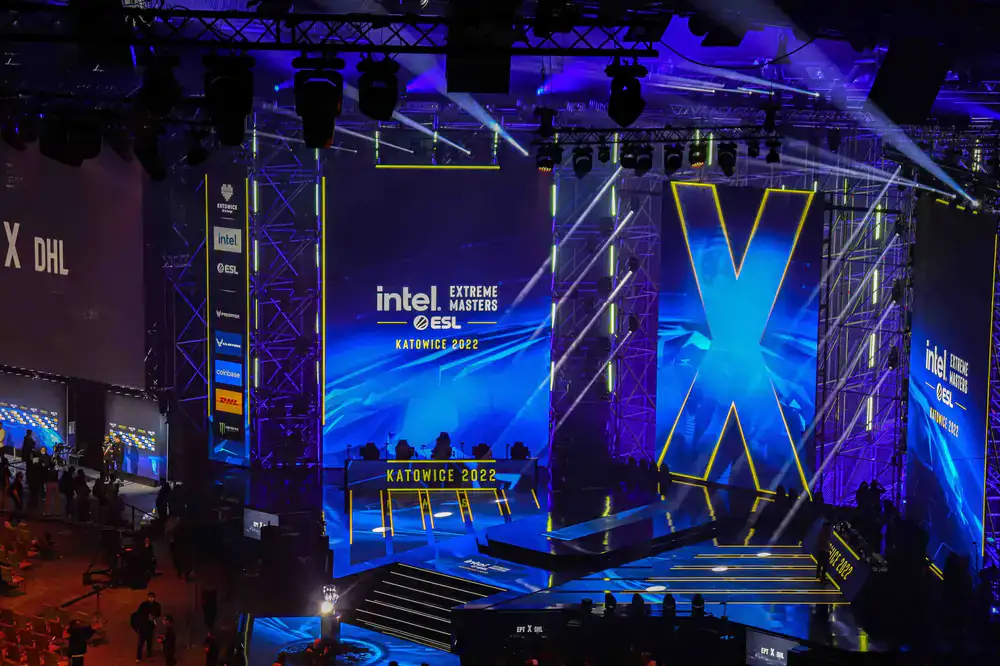 Dramatic view of the main esports stage and focused crowd