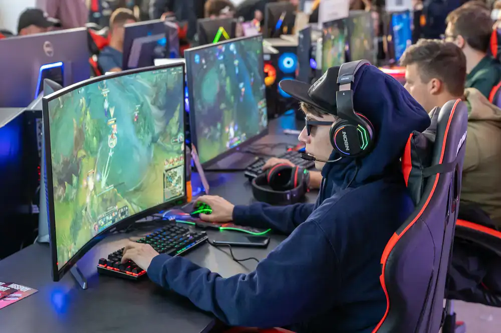 Competitors focused on their monitors during a main stage tournament at the arena
